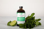 Cocktail and Sons all Natural Mojito Mixer with it's two main flavoring agents, fresh sharp lime and aromatic mint